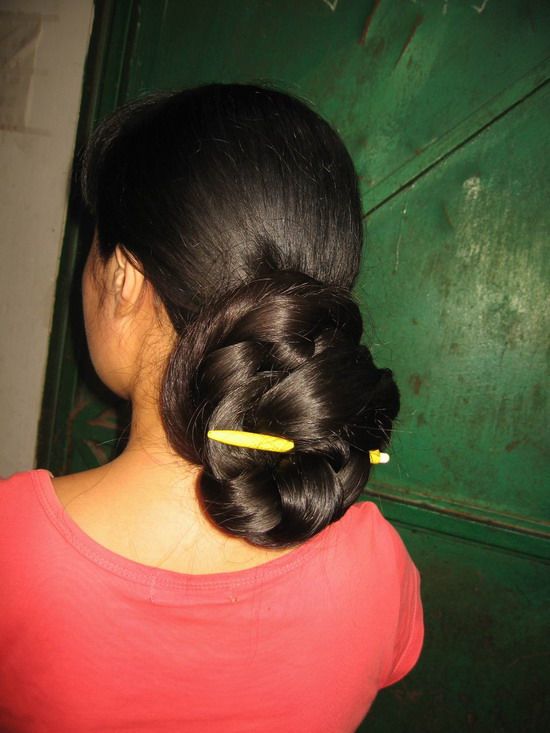 Thick and heavy long braid made into huge bun
