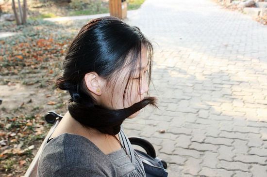 Beijing girl shew long hair in autumn