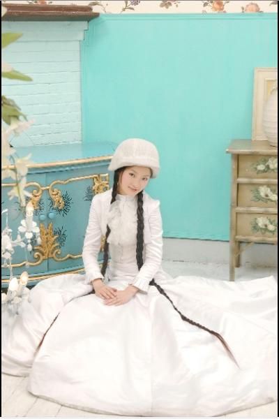 Beautiful long braid girl with white hat and skirt