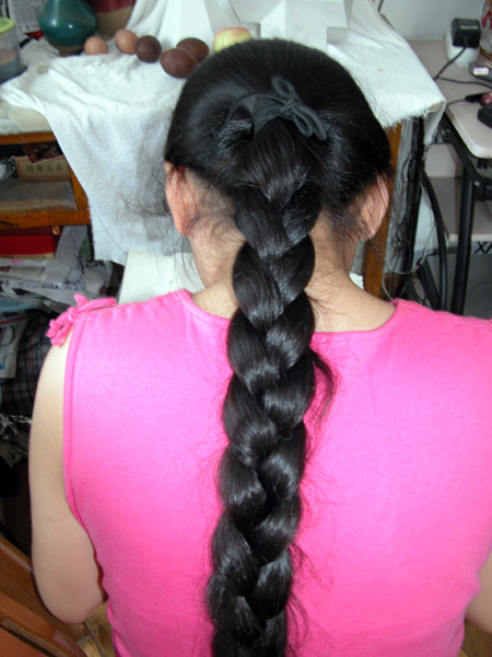 Young girl with knee length thick braid-2