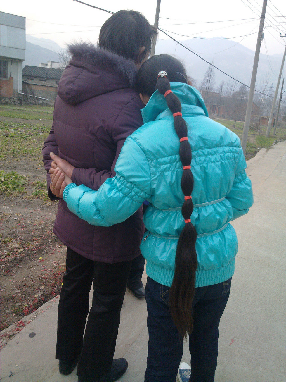 Young girl with her mother and long braid