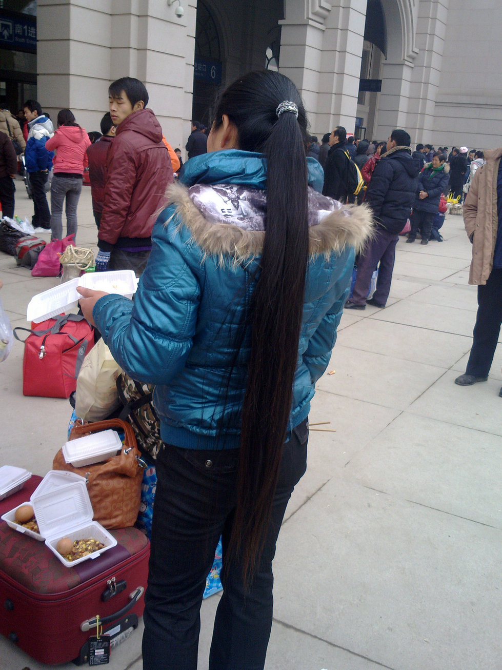 Streetshot of long ponytail at Wuhan railway station by lidunjun