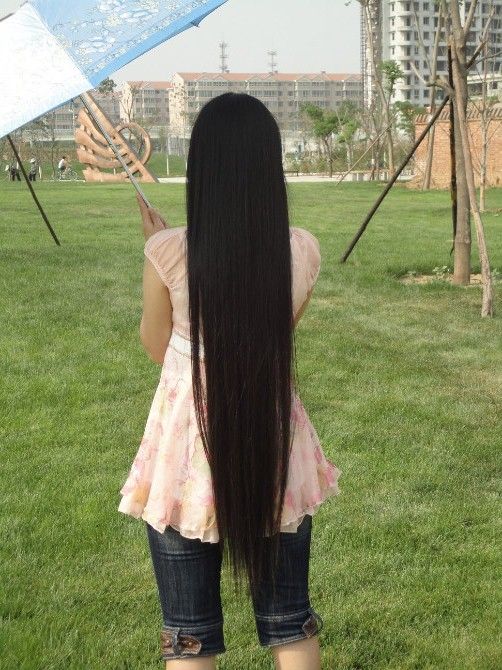 2 girls have similar long hair