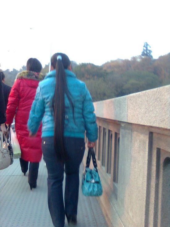 Streetshot of thigh length ponytail