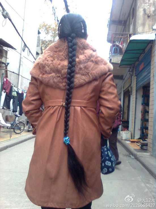 Streetshot of knee length braid