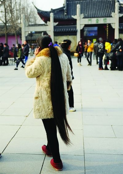 Streetshot of long ponytail in Fuzi temple in Nanjing