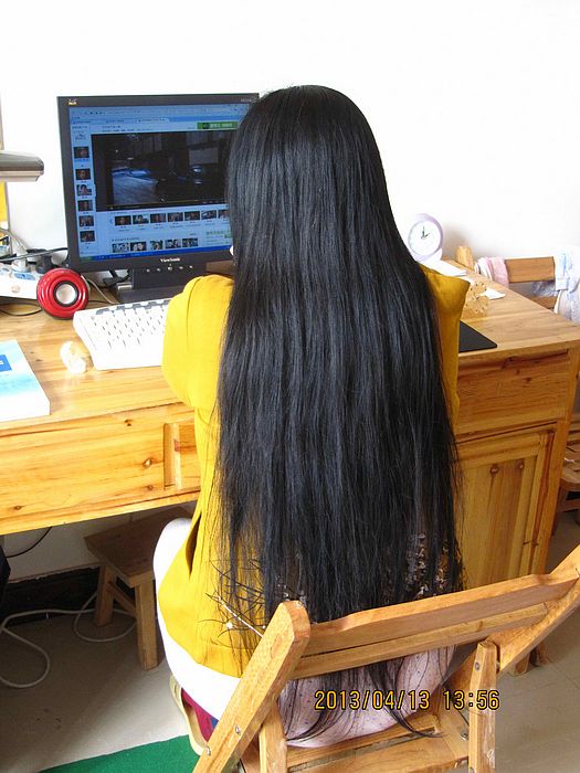 Long hair lady view computer screen
