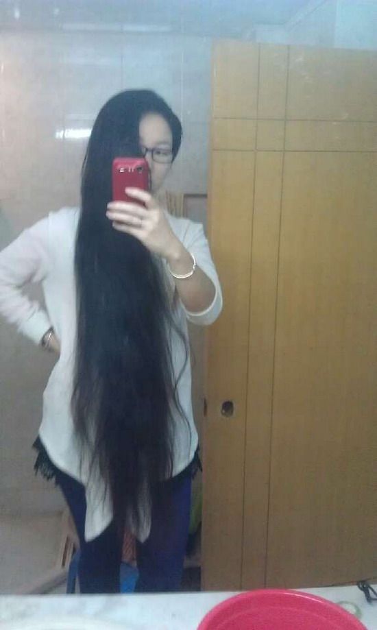Long hair girl take photos by herself