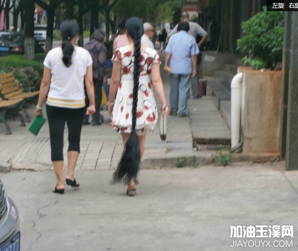 Streetshot of super long braid in Yuxi city, Yunnan province