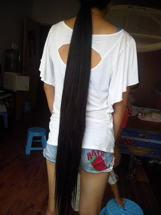 Knee length long hair girl not in good living condition