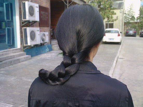 Butt length long hair in silky braid