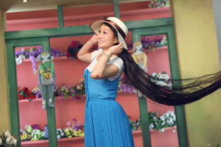 1.7 meters long hair lady from Shangrao-white hat and blue skirt