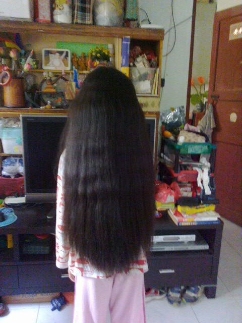 11 years little girl has very thick waist length long hair
