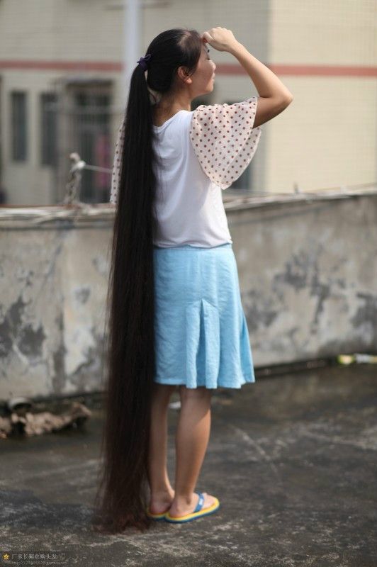 Very beautiful long hair girl on roof - []