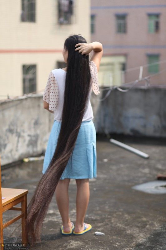 Very beautiful long hair girl on roof