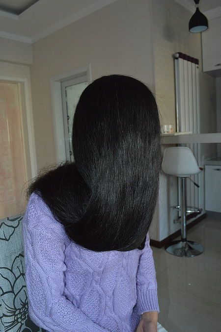 Lady wash and comb her very long hair