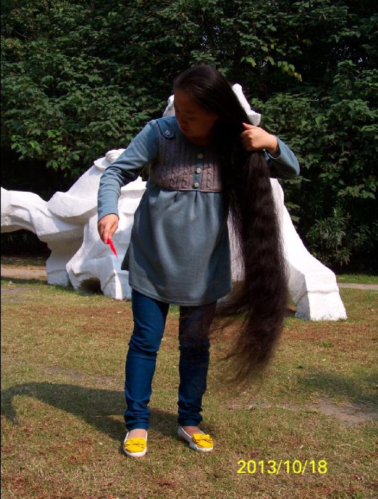 Young lady has thick long hair
