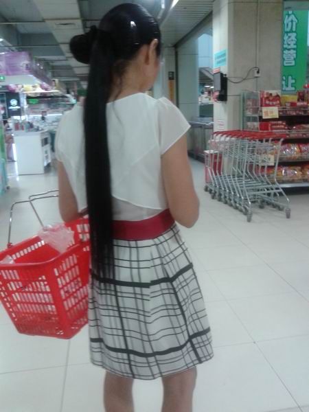 Streetshot of wrapped ponytail in supermarket by huqing