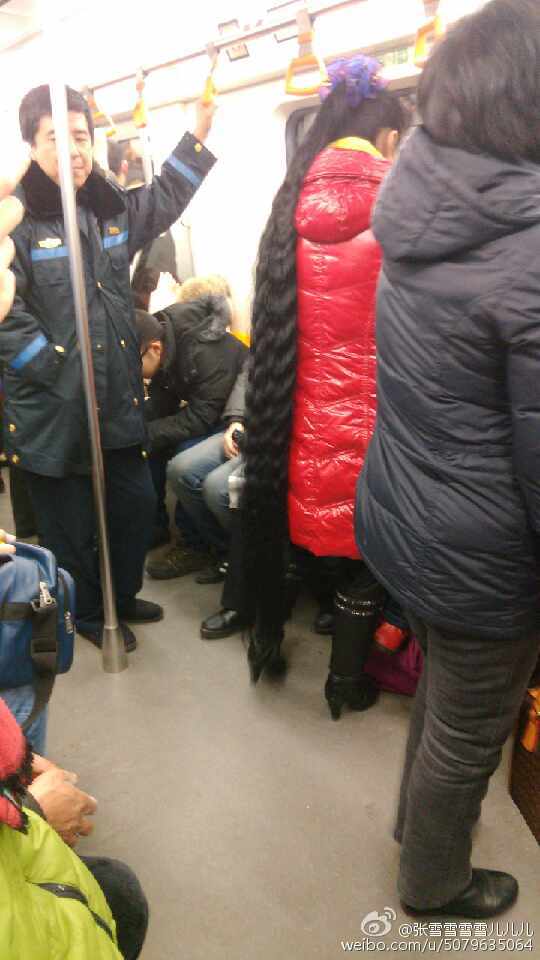 Super long ponytail in subway