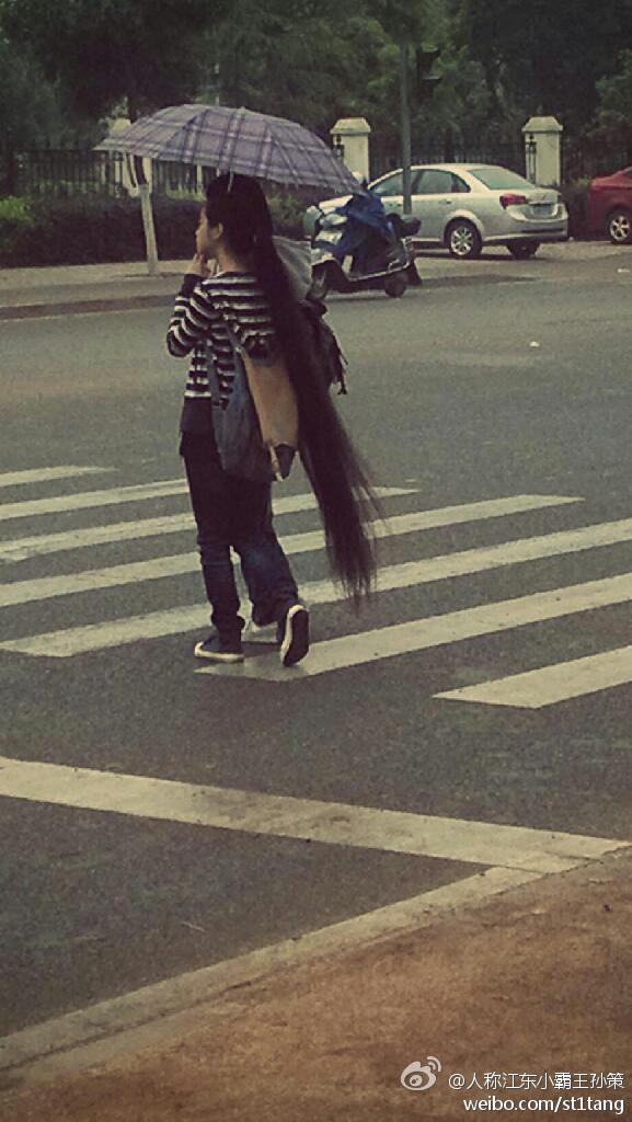 Super long ponytail went across street