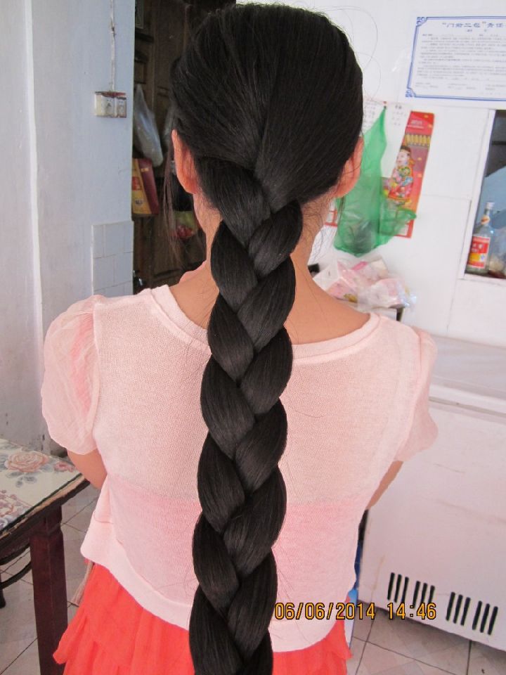 Super thick long braid of young girl