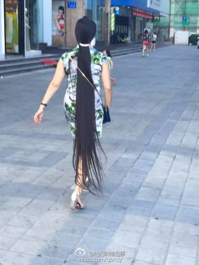 Floor length long ponytail walked on street