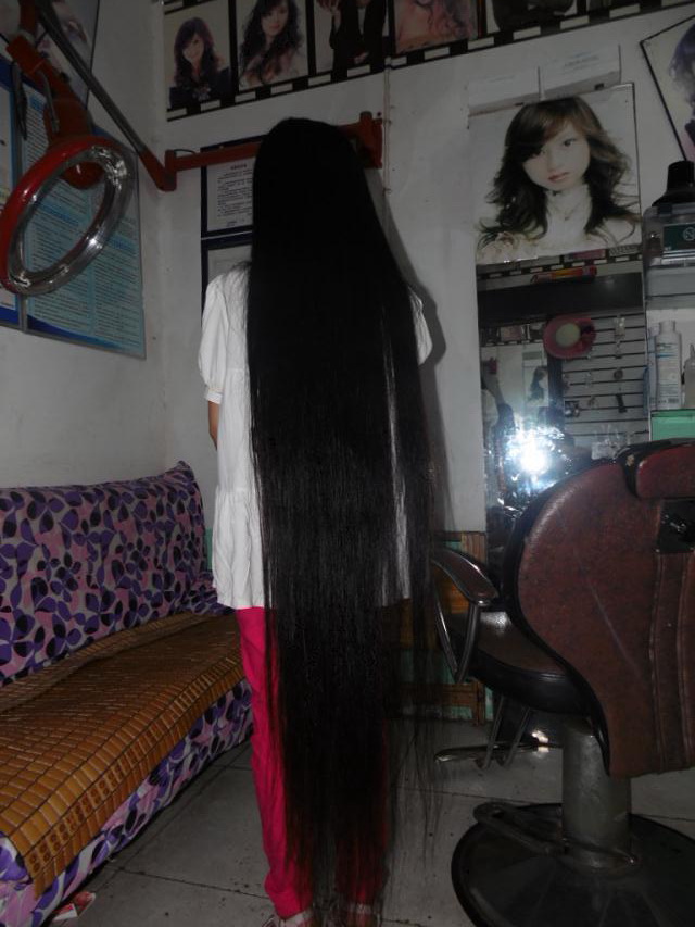Floor length long hair lady in hair salon