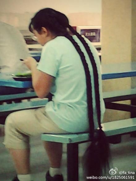 She sat down with double thick braids