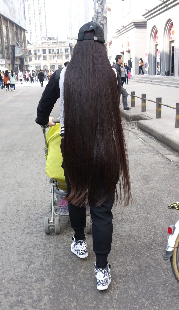 Streetshot of knee length long hair mother by eflikai