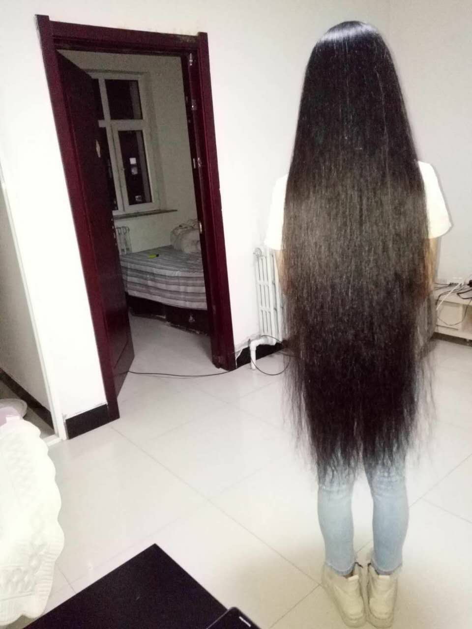 Young girl with knee length long hair