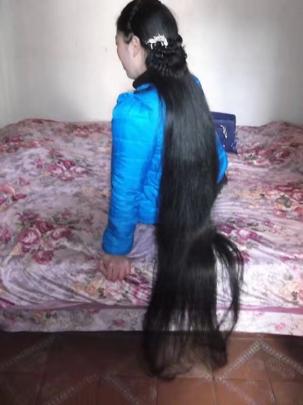 Long ponytail on bed and chair
